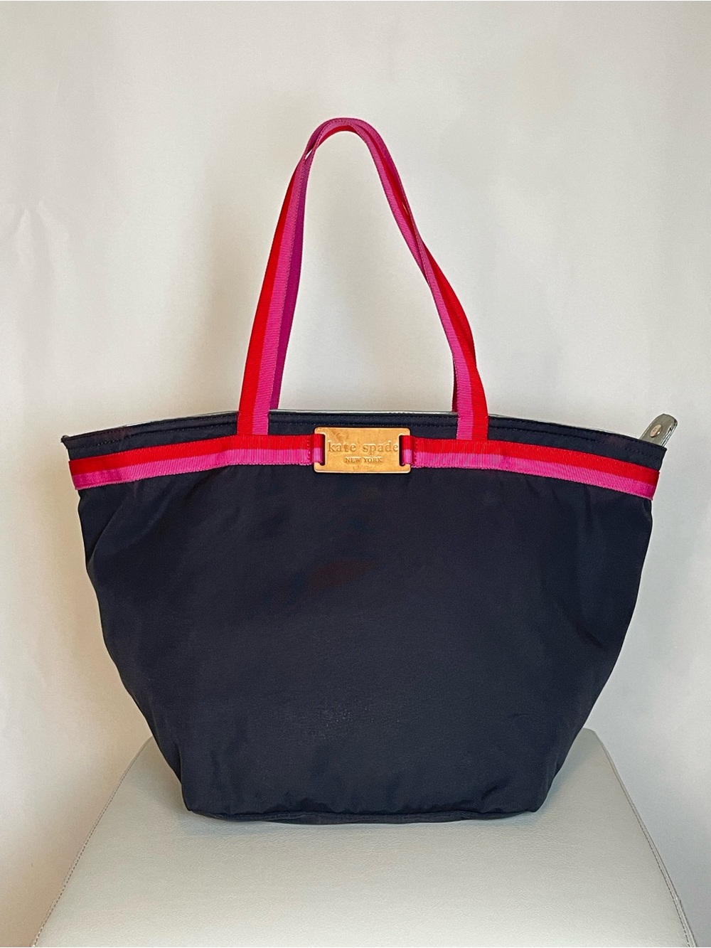 kate spade black tote with pink and red trim